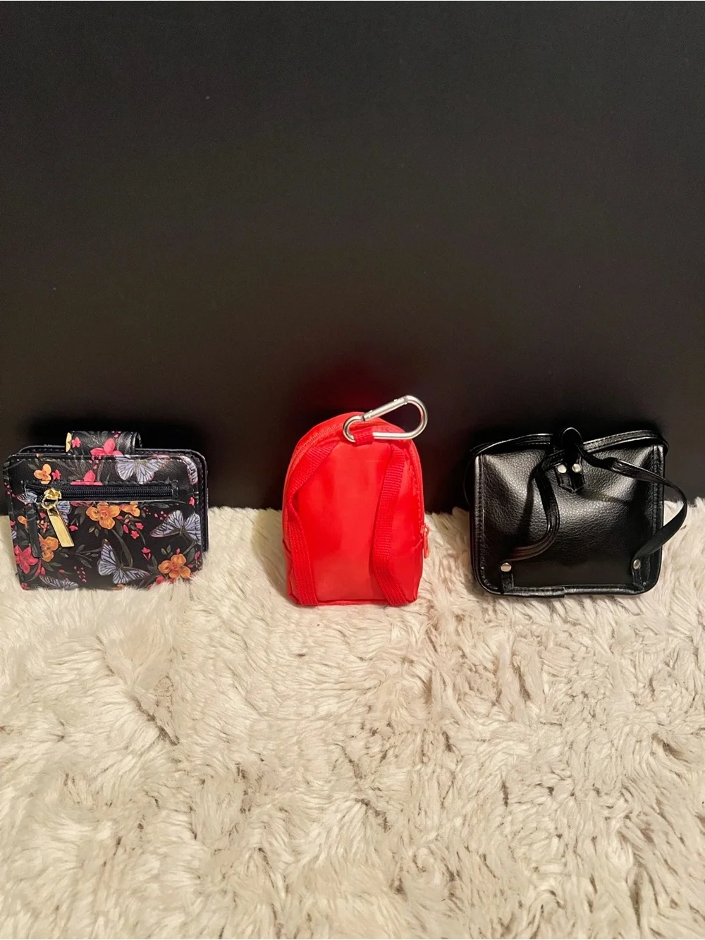 Three piece bundle of two coin, purses, and one small wallet